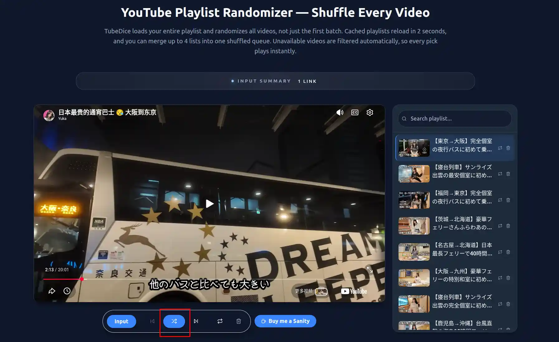 The screen displaying a YouTube video playing with the full playlist visible below, showing the shuffle button users can click to randomize the playlist order.
